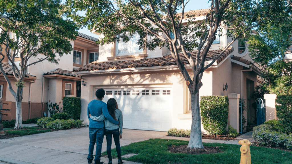 Couple looking at the real estate house 