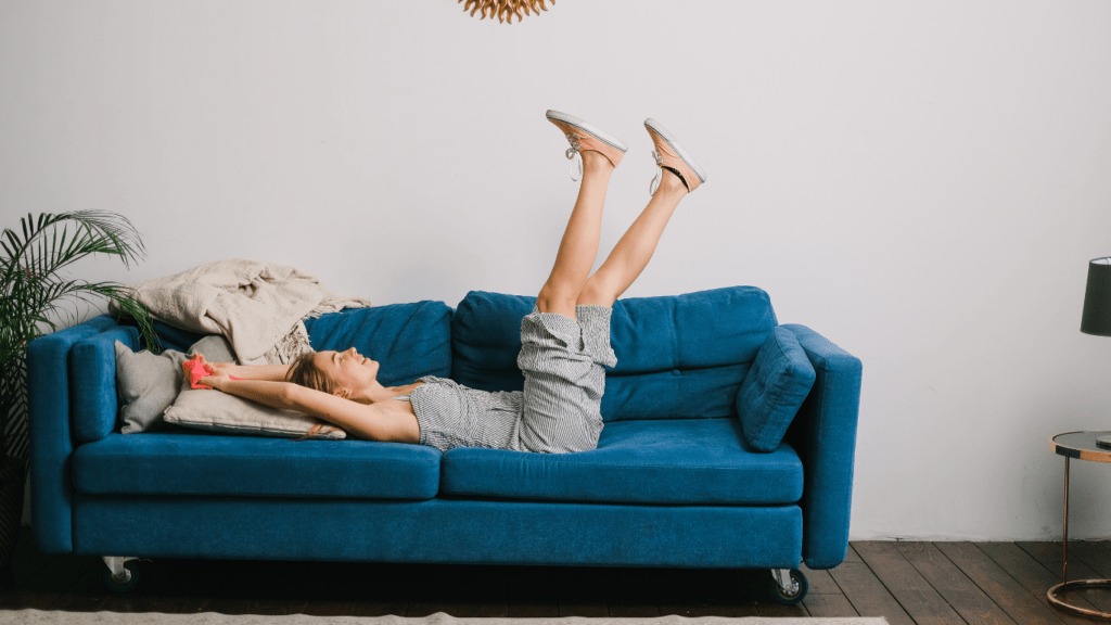 Woman lying on sofa